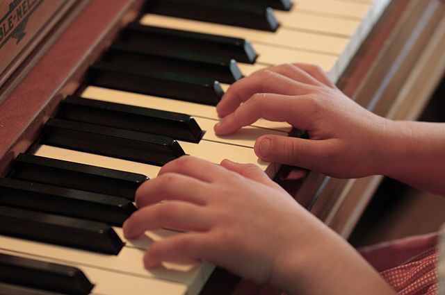 Child practicing piano